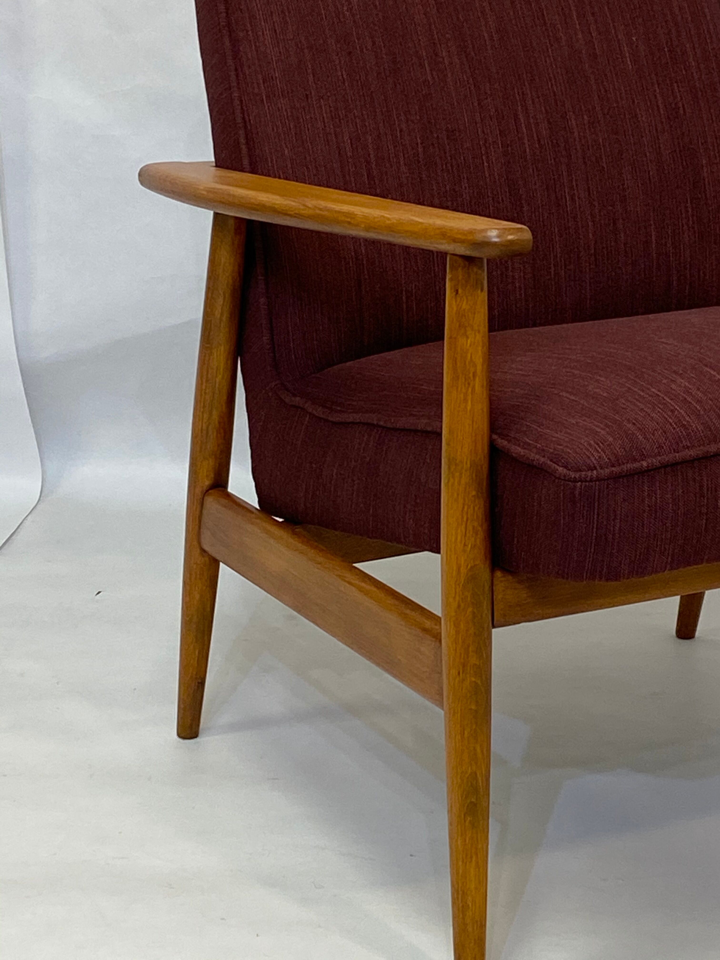 Chair created by Mr. Zieliski year 60 burgundy fabric.