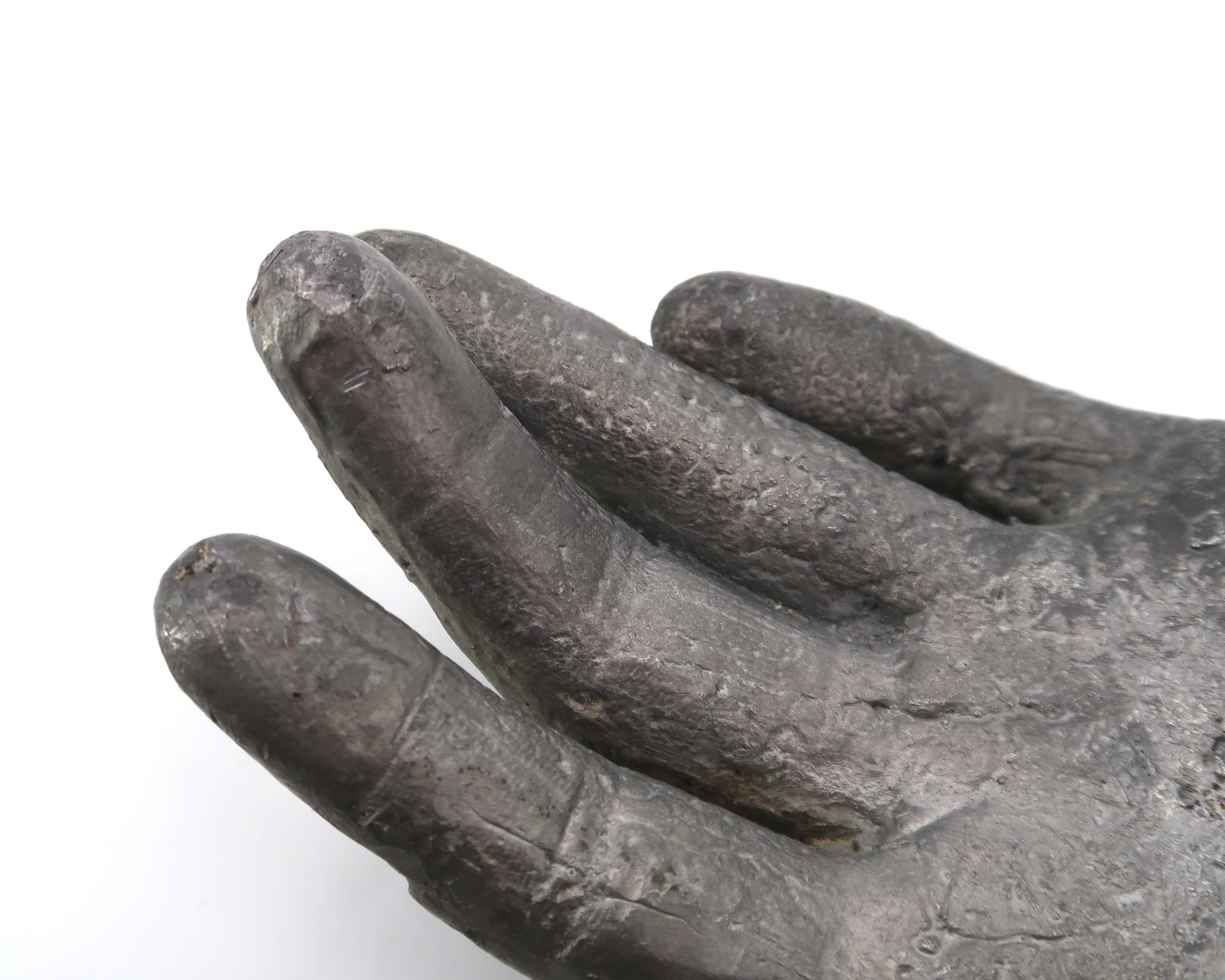 Cast iron silver-coloured catchall in the shape of a hand, 1970s sculpture.