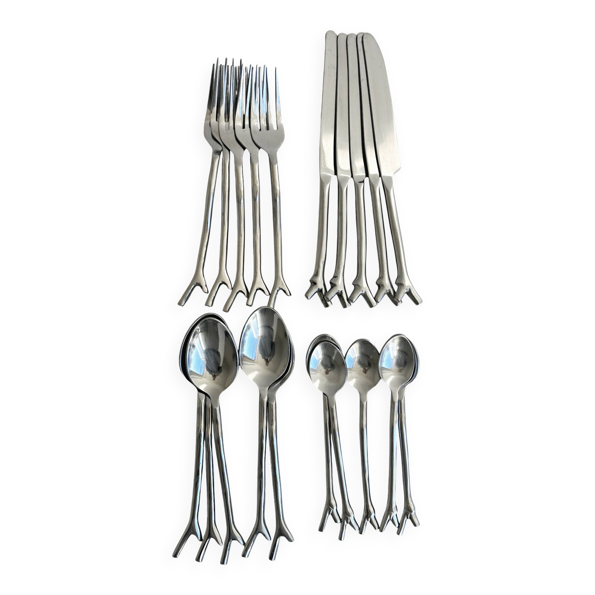 Set of 20 stainless steel cutlery with branch pattern.