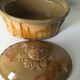 Old terrine of pastry or foie gras in beige glazed earthenware with brown drips. Very beautiful pa