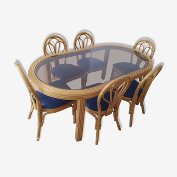 Rattan dining table with 6 matching rattan chairs
