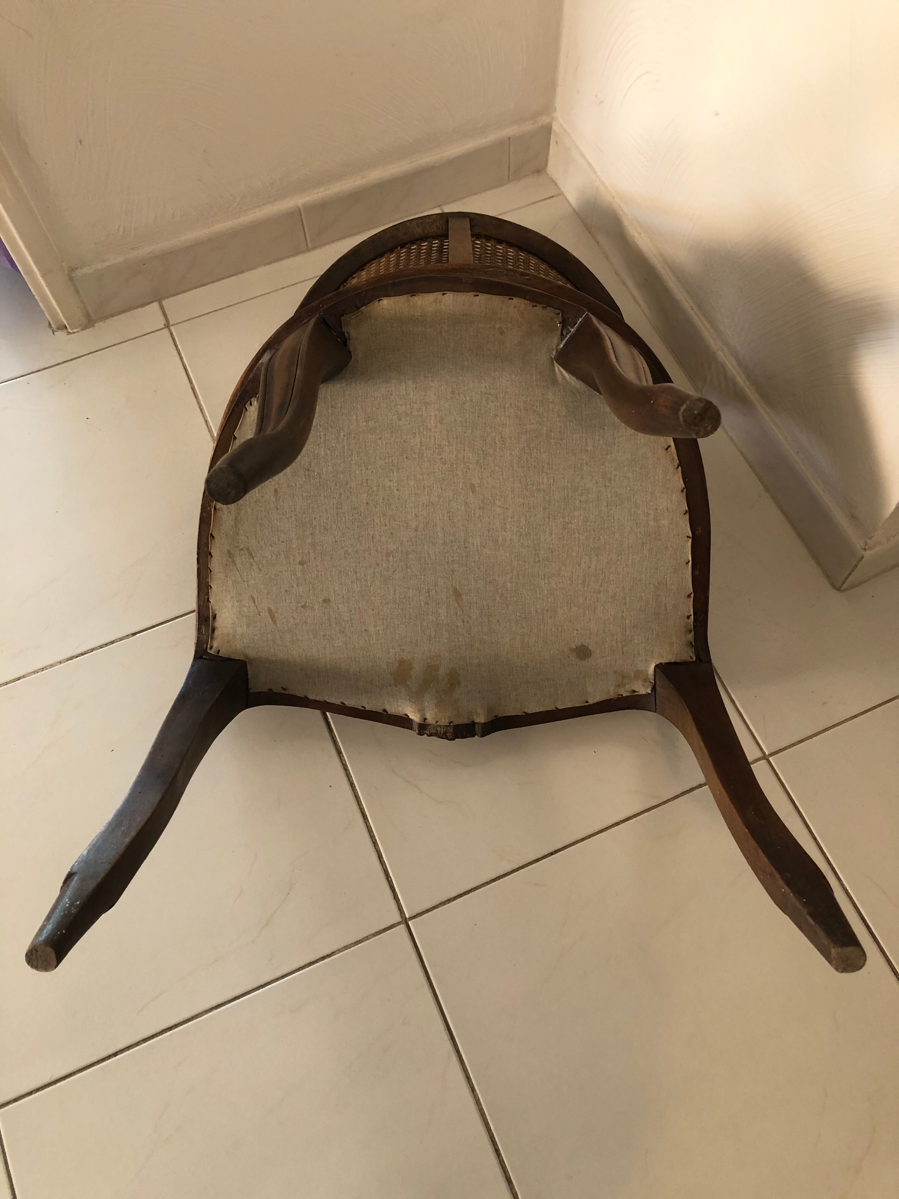 Old wooden armchair and cannage