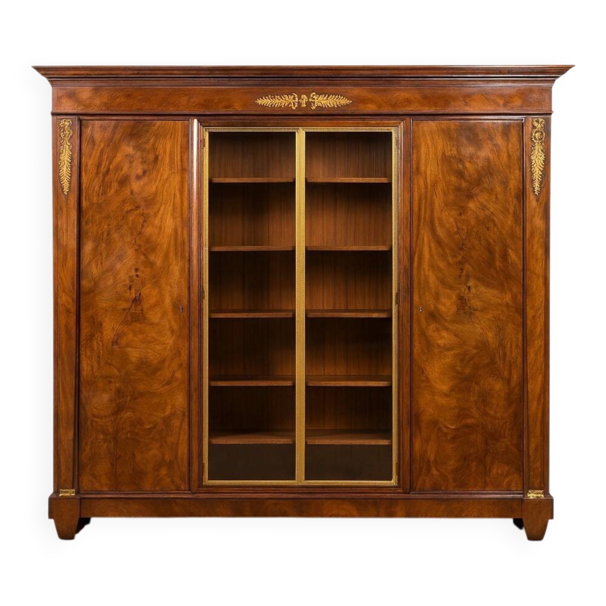 Bibliothèque en acajou flammé style Empire vers 1900