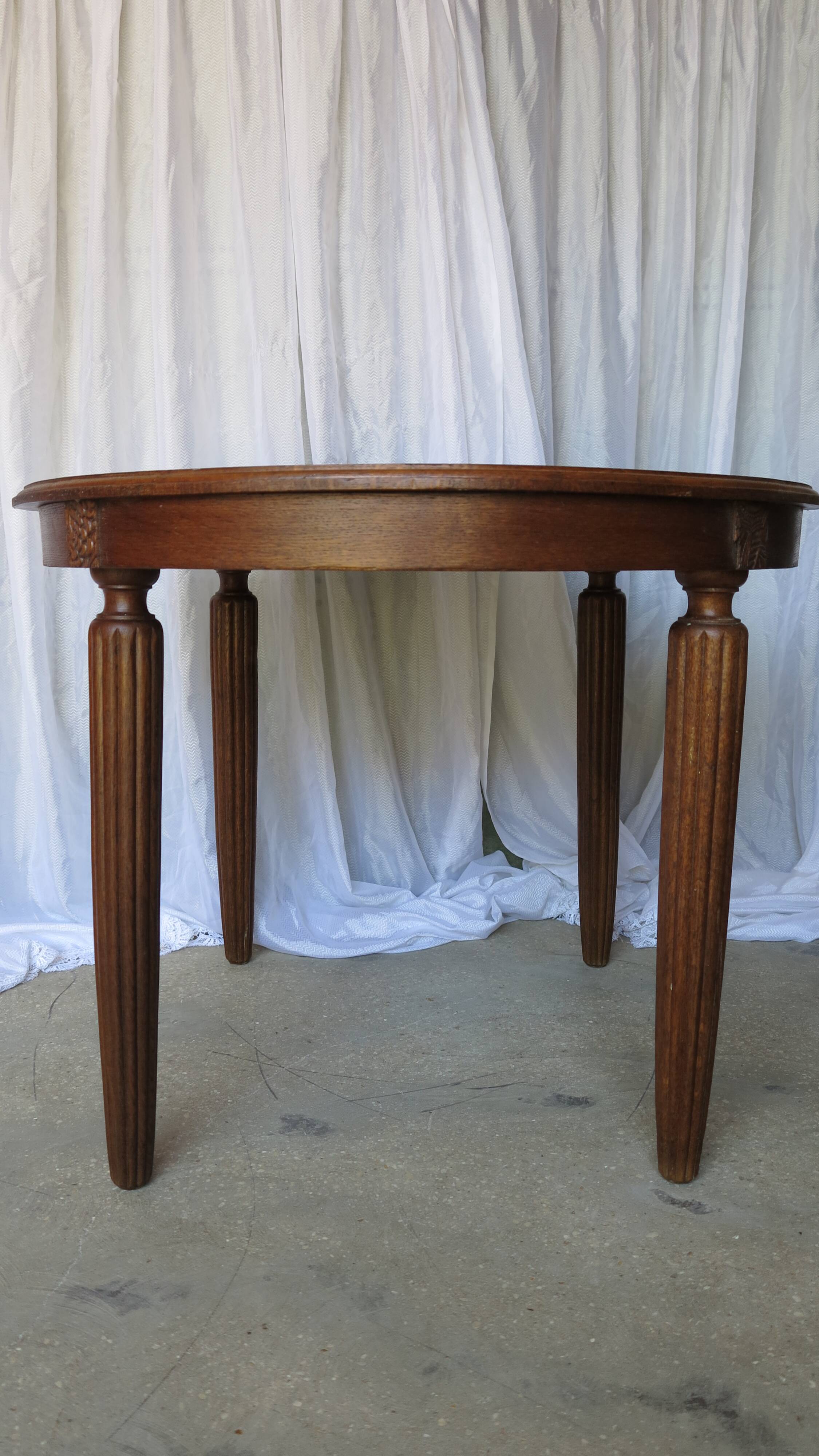 1930s oak dining table, slightly oval.