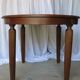 1930s oak dining table, slightly oval.