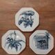 Set of three ironstone plates decorated with birds.