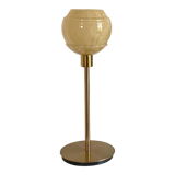 Table lamp with an antique vintage glass lampshade, between gold and camel, with a golden foot