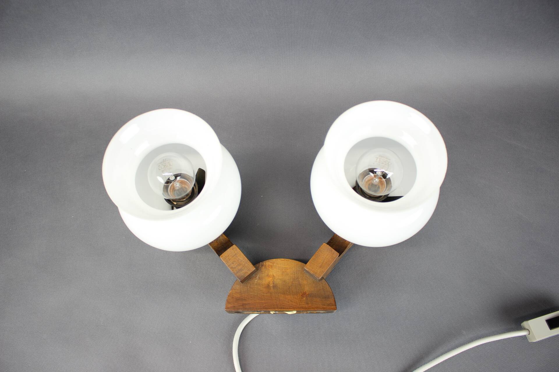 Czechoslovak wall lamp from the 1960s with Valasske Mezirici glass and a wooden base.