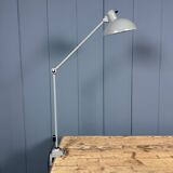 Grey two-arm Kaiser Idell clamp lamp model