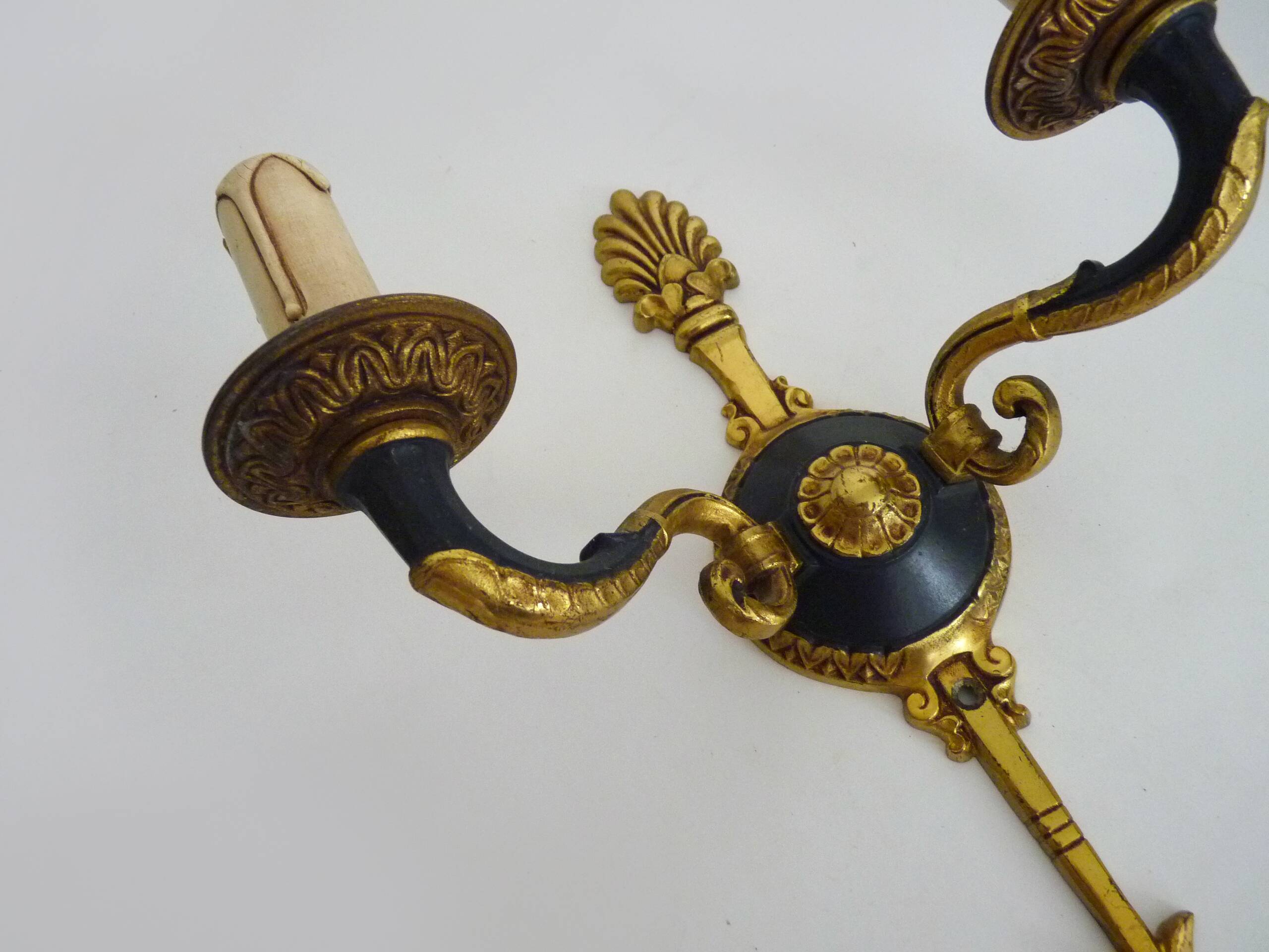 Pair of wall sconces in the Empire style with double lights in bronze.