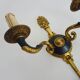 Pair of wall sconces in the Empire style with double lights in bronze.