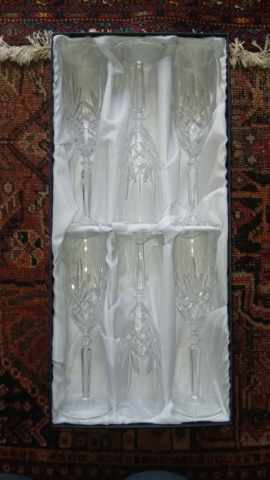6 crystal champagne flutes from Lorraine Walsheid in their case.