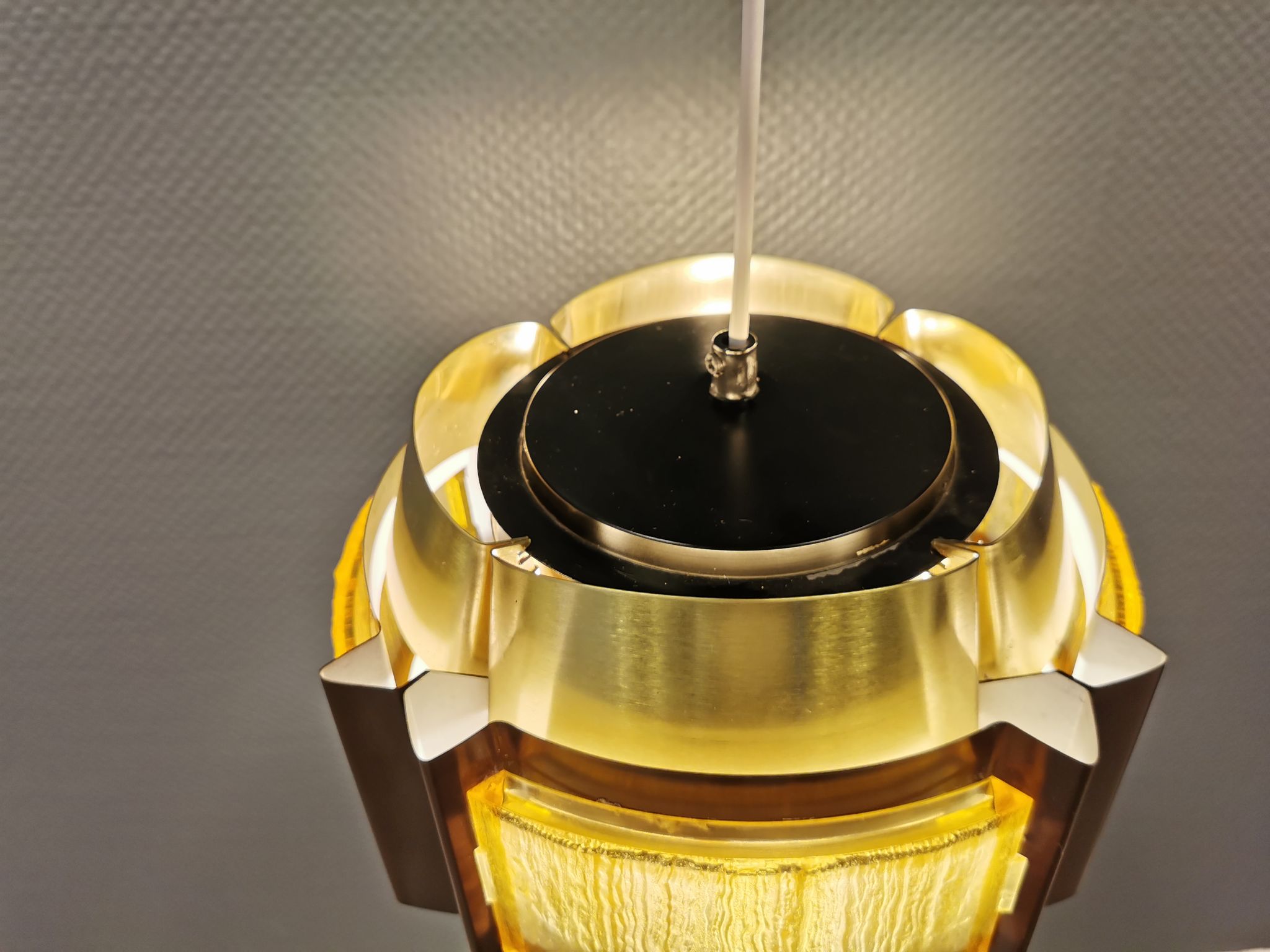 Danish hanging lamp, made in brass colored and brown metal, with yellowish hard pressed plastic deta