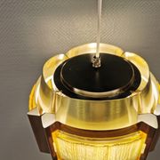 Danish hanging lamp, made in brass colored and brown metal, with yellowish hard pressed plastic deta