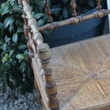 Chaise d’angle ancienne en bois façon bambou assise en paille