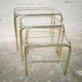 Trio of nesting tables in gold metal