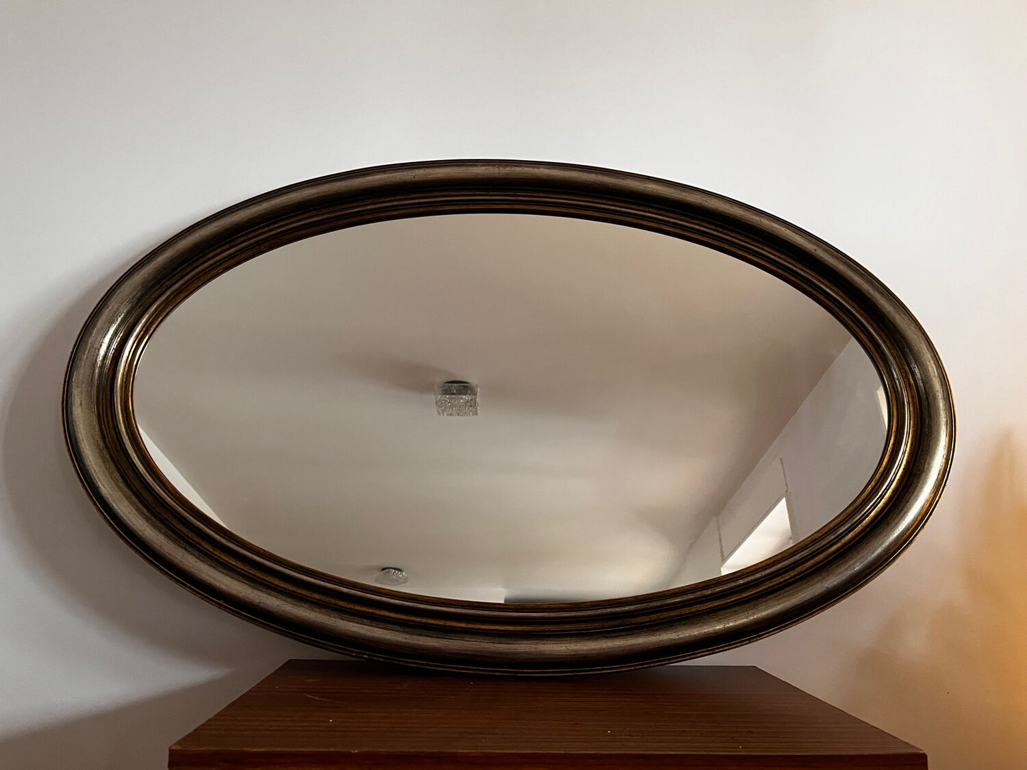 Antique oval mirror made in Belgium.