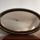Antique oval mirror made in Belgium.