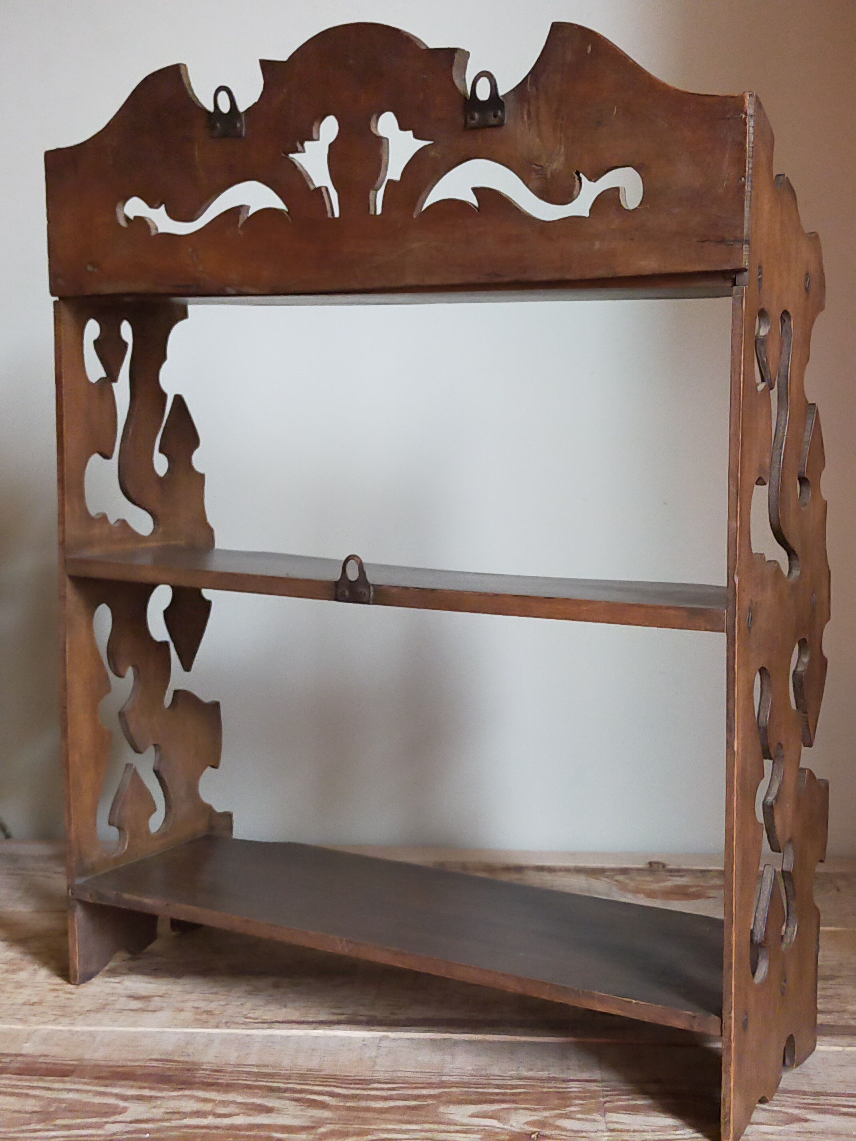 Old carved wooden wall shelf