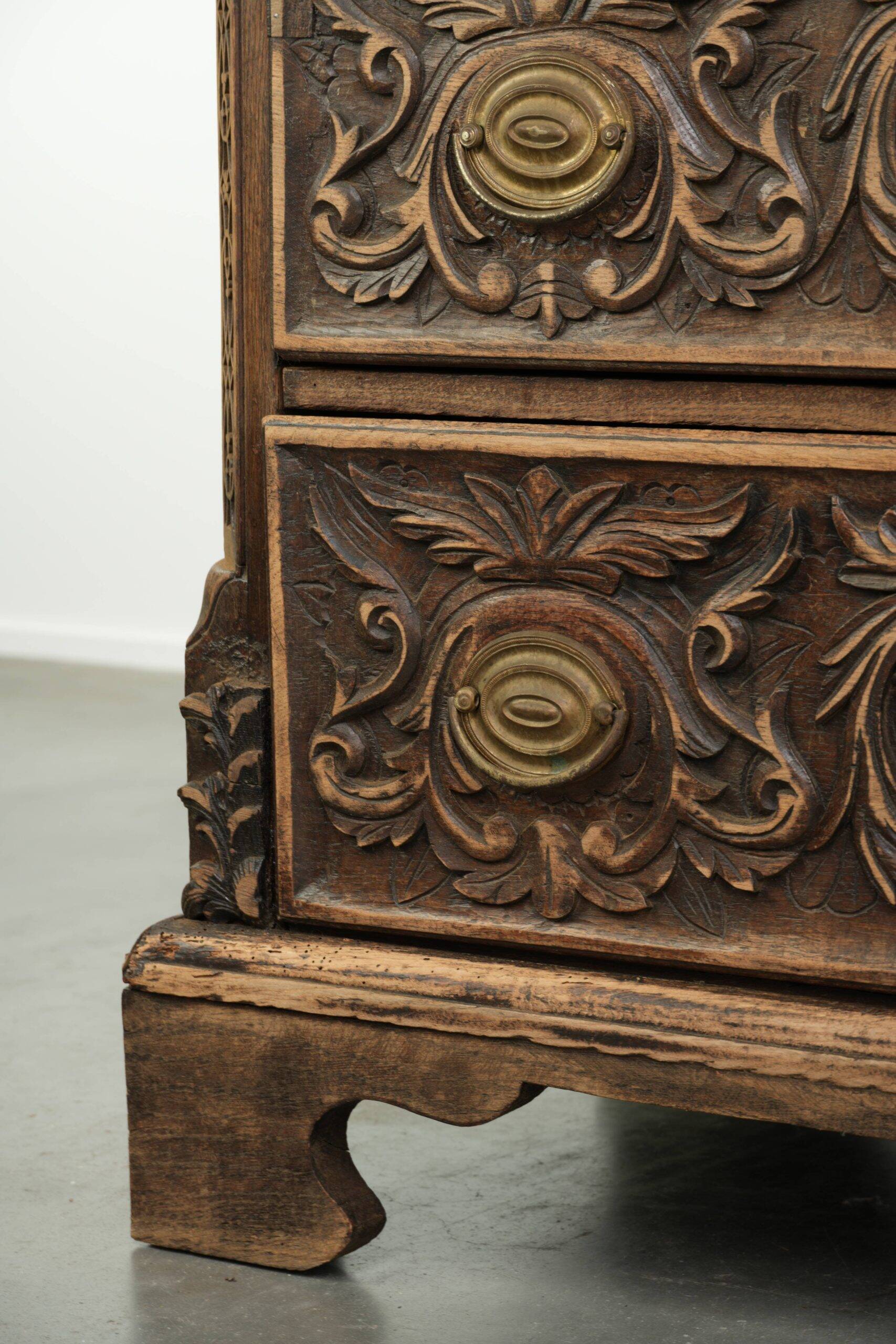 Richly carved English oak chest of drawers from the 18th century