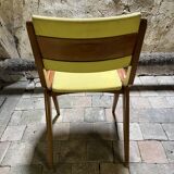 Vintage modernist chair in curved wood and yellow leatherette - 50s/60s