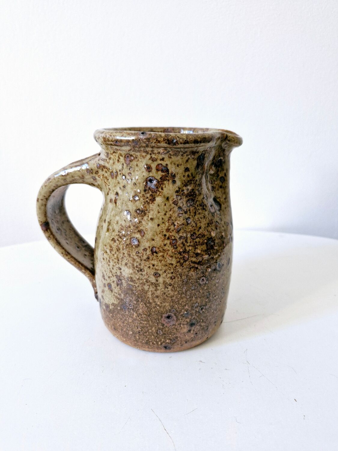 Old pitcher in pyrite stoneware