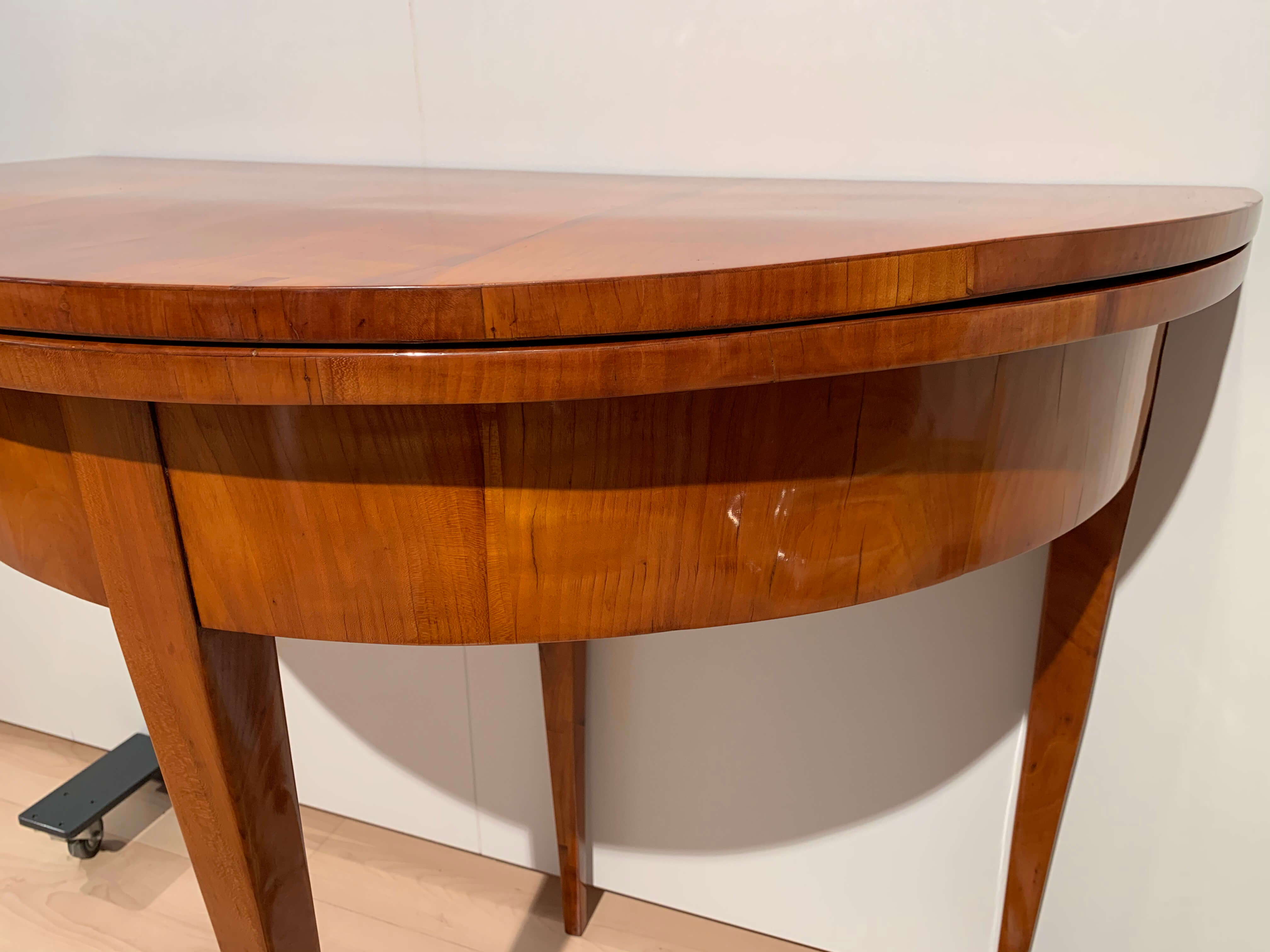Biedermeier demi-lune fold-out table, cherry veneer, south germany, circa 1820