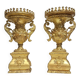 Rare pair of carved and gilded wooden vases, with a refined style inspired by the Empire.
