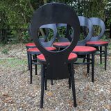 6 vintage Baumann seagull model chairs, black lacquered with red Skai seats.