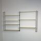 Vintage Nisse Strinning wall rack with 7 off-white shelves