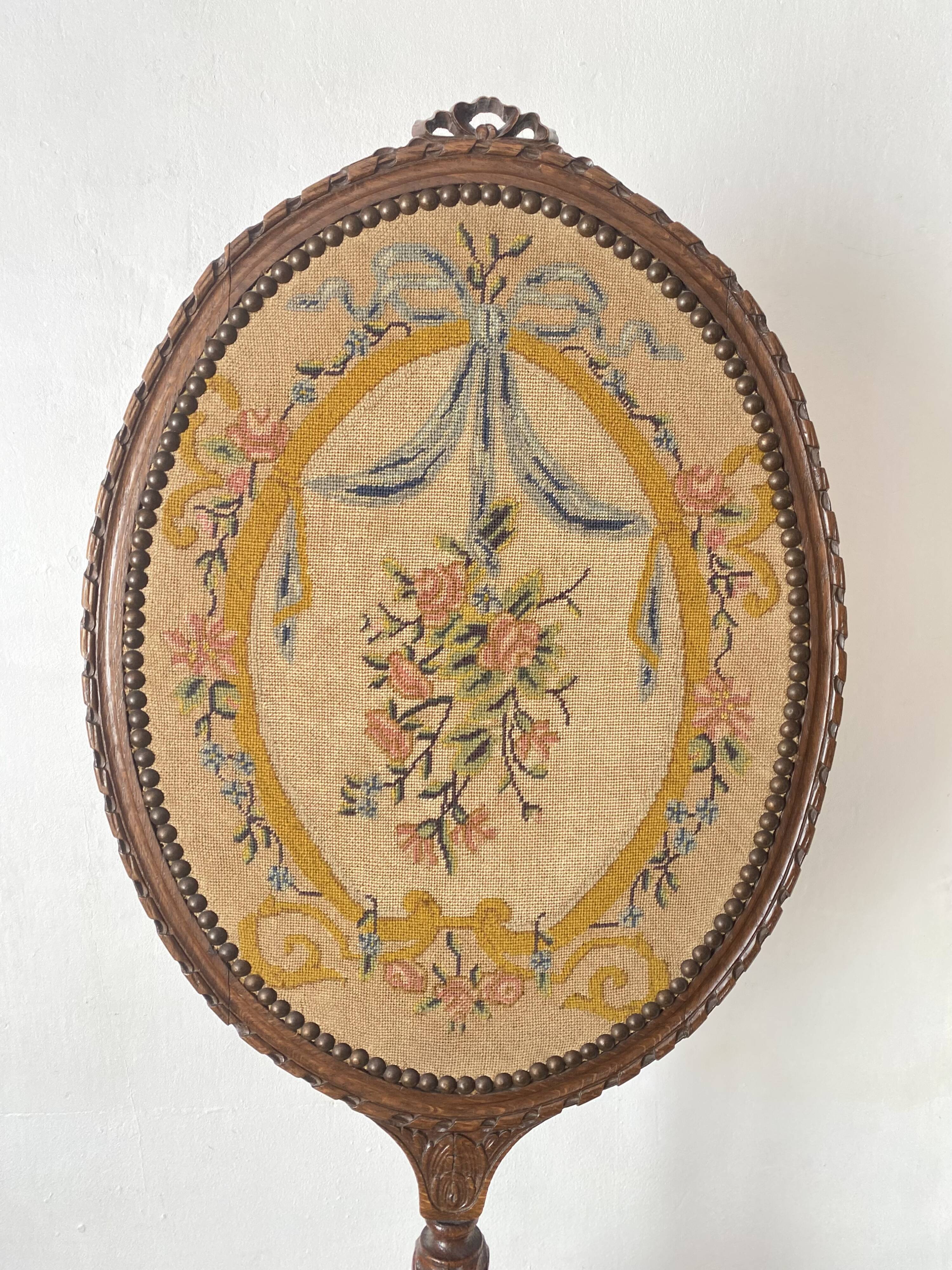 Wooden and embroidered fabric fireplace screen