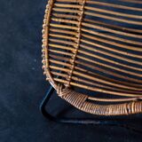 Rattan armchair with metal legs