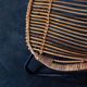 Rattan armchair with metal legs