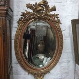 Golden oval mirror