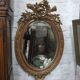 Golden oval mirror