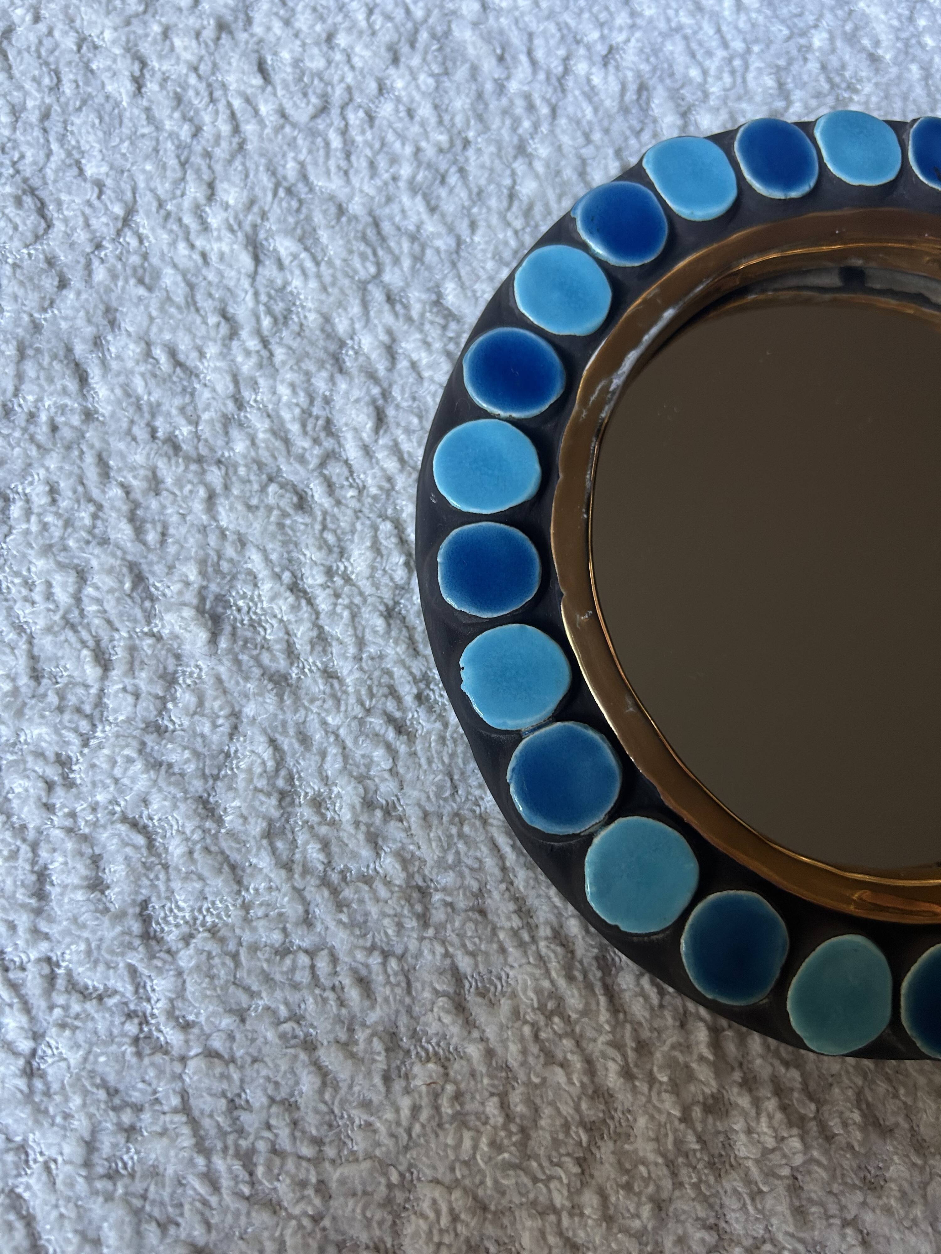 Mithé Espelt handheld mirror