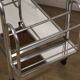Vintage 1970s rolling dessert trolley in chrome metal and mirrored glass.
