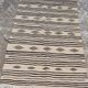 Traditional hand-woven beige and black carpet