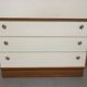 Low chest of drawers with 3 drawers in mahogany and white satin, France circa 1980.