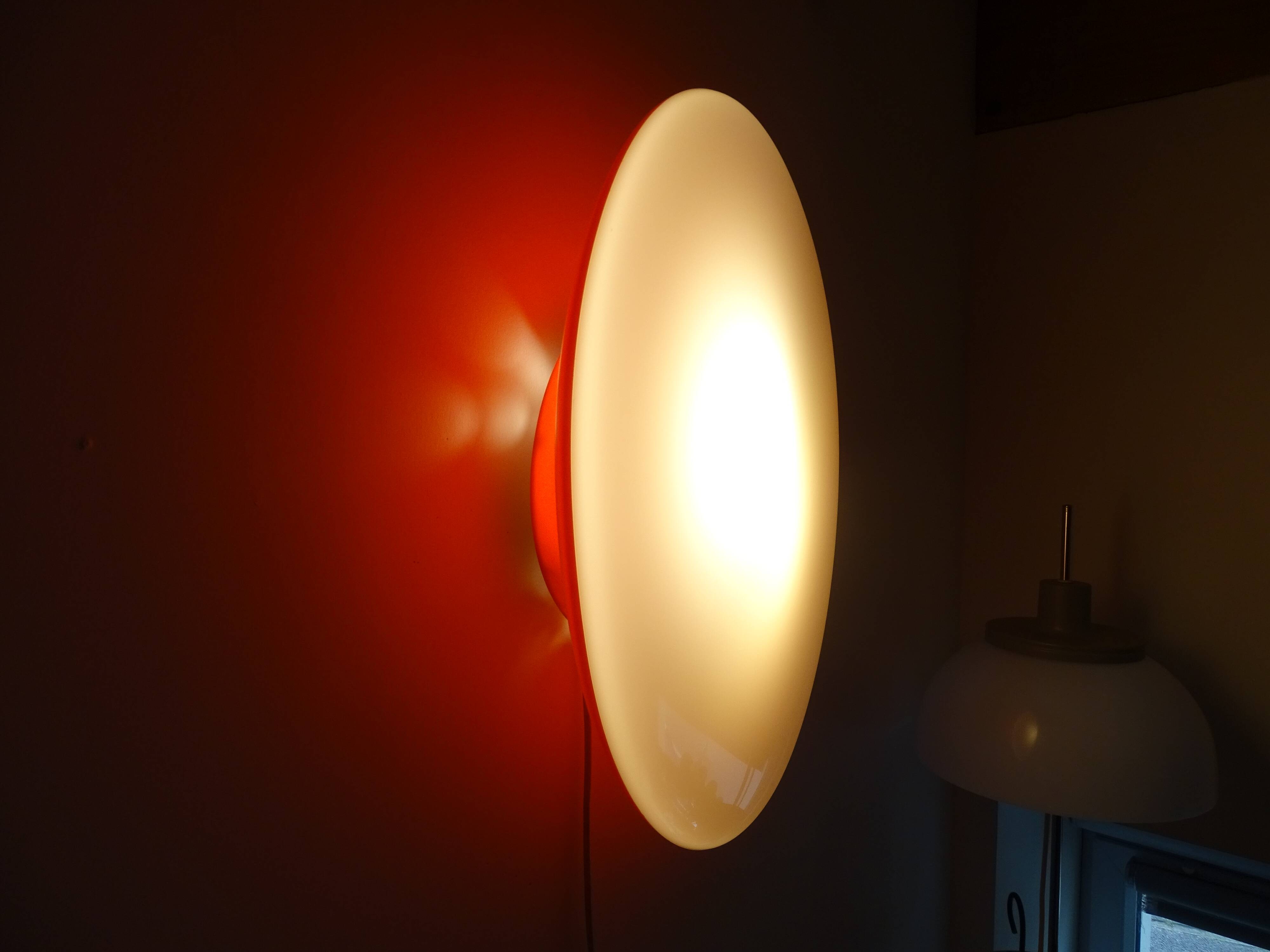 Oval wall lamp design ARTEMIDE 1980 by Patrick Jouin orange/white