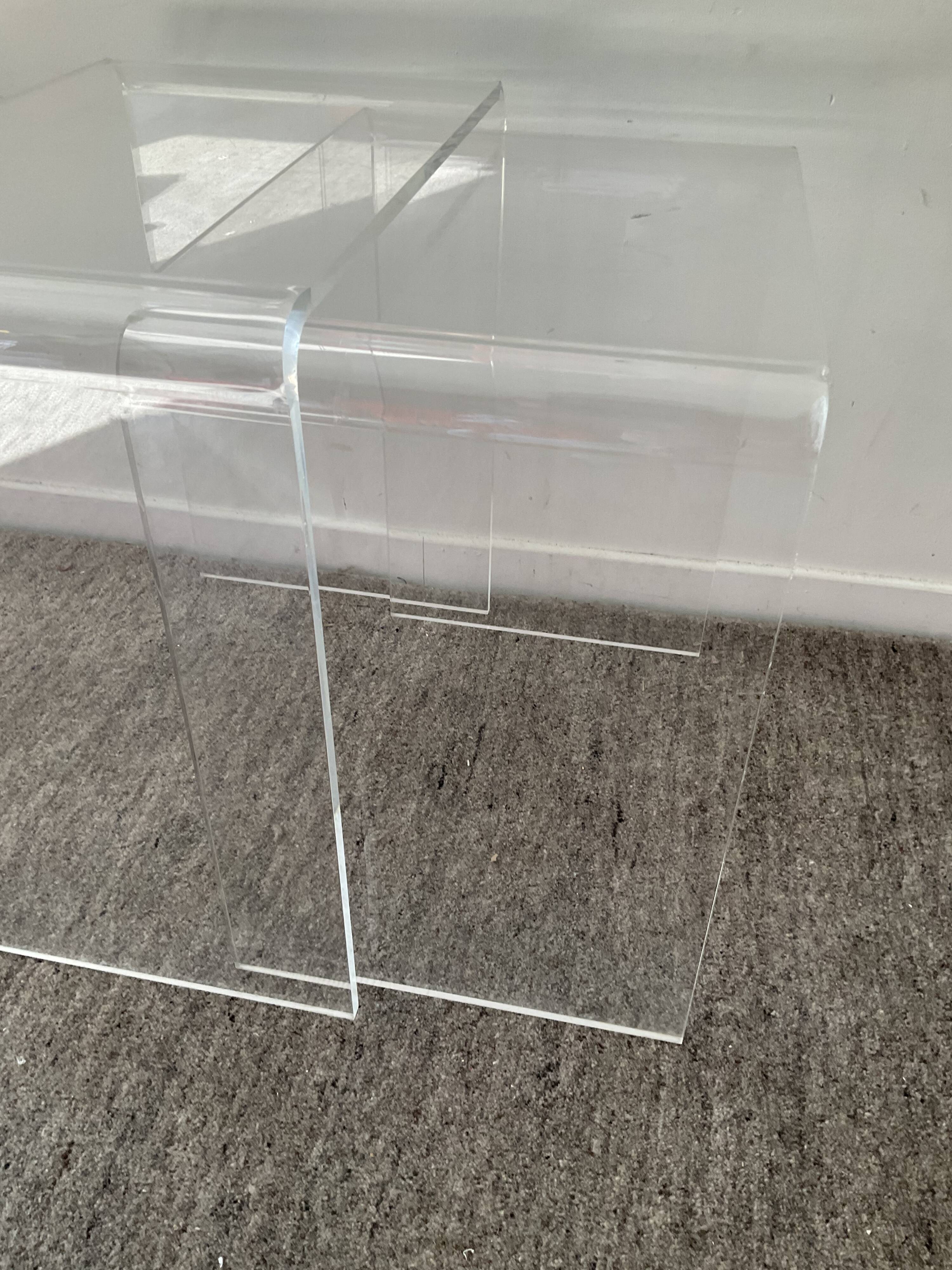 Duo of pull-out tables in plexiglass 70s