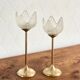 Pair of tulip-shaped candle holders in frosted glass and brass.