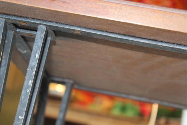 Black metal footing wooden coffee table