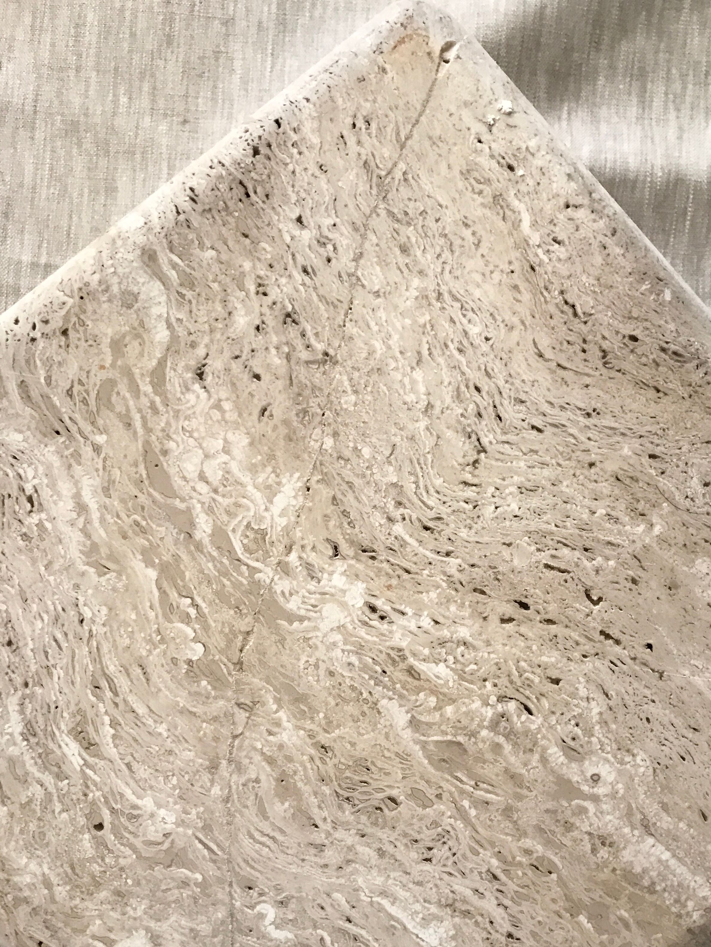 Sculptural travertine coffee table