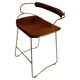 Contemporary sculptural bar stool with a metal back in aged brass and cognac leather.