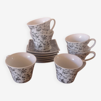 Black and white cups with plates