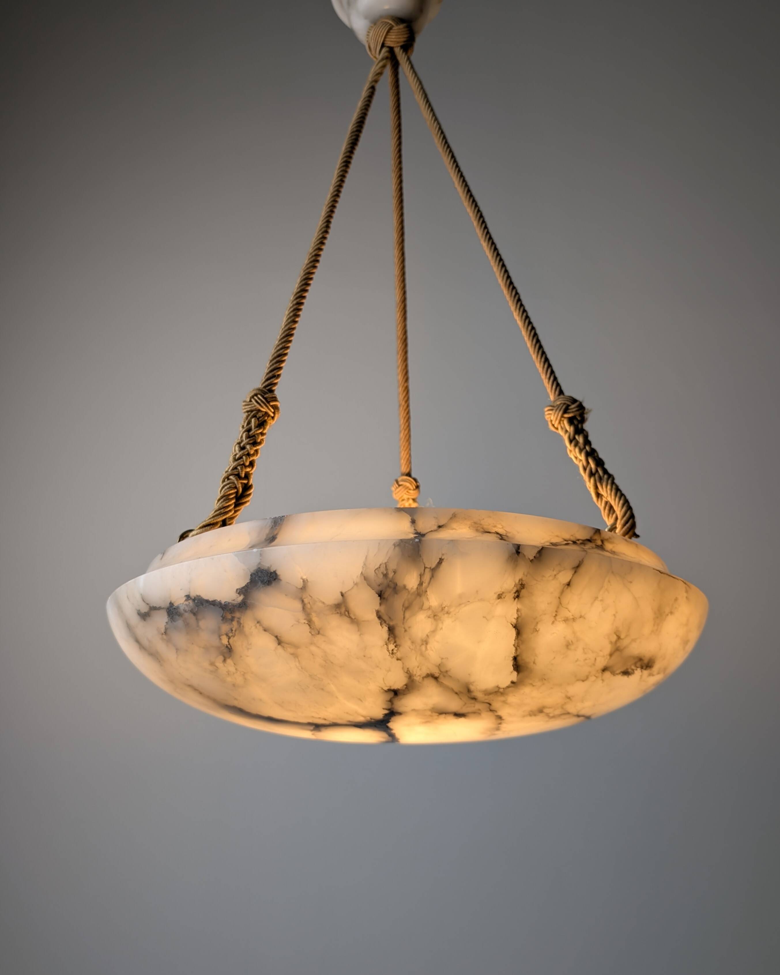 Timeless Art Deco pendant lamp in carved alabaster with black veins, 1920s