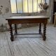 Paneled walnut desk with turned legs, 1900