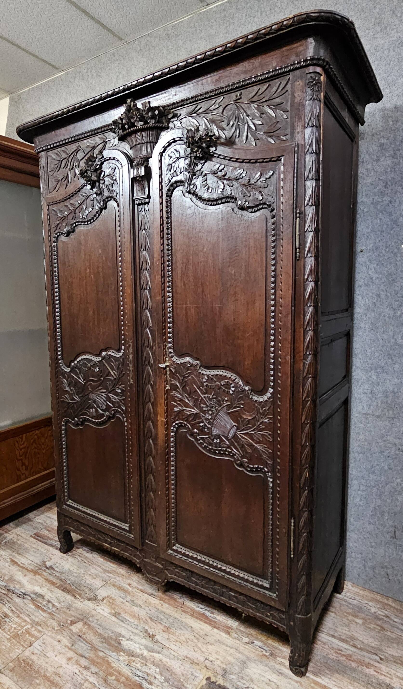 Large Norman wedding wardrobe in carved oak – Louis XV period