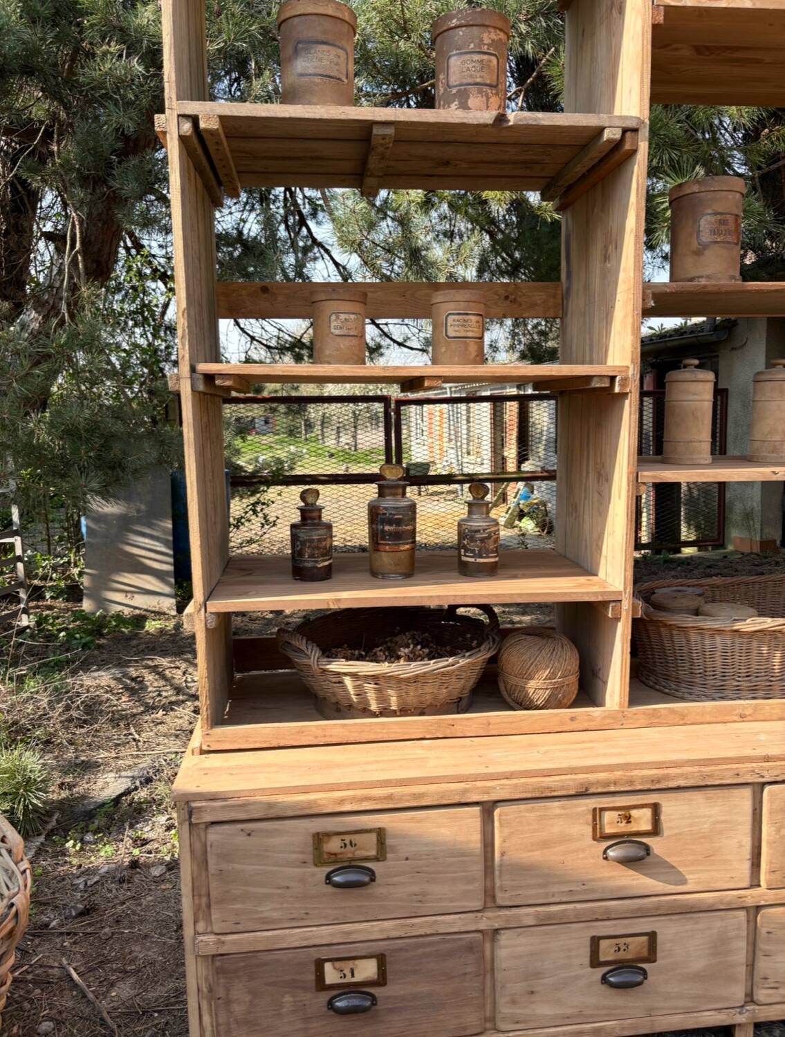 Large antique workshop furniture with drawers and shelves.